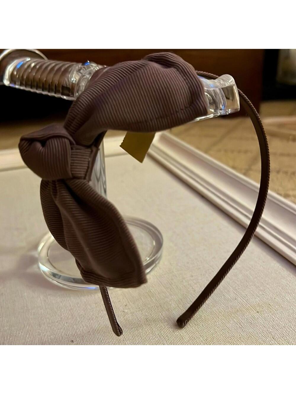 Brown grosgrain ribbon headband w bow on the side. NWT